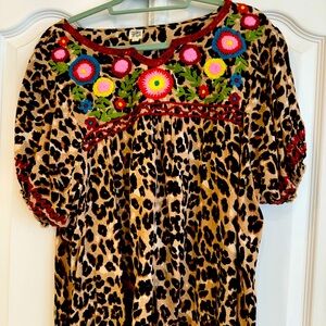 Frank & Ivy Size XL cheetah top with flower embroidery.